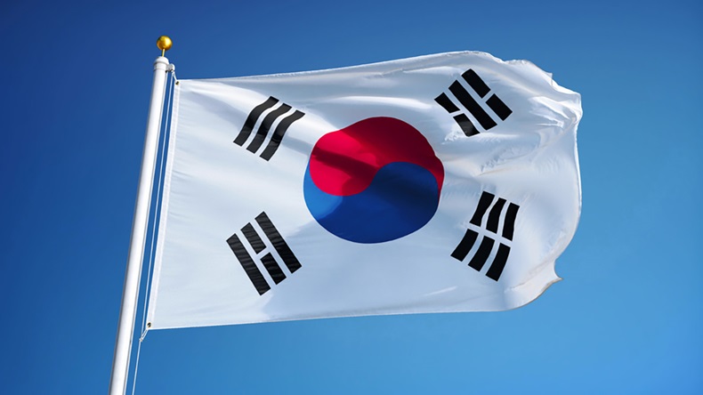 Flag of South Korea flies in front of a blue sky