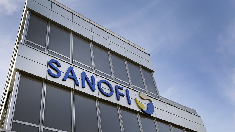 A Sanofi logo sits on the facade of the company's headquarters on December 11, 2020 in Gentilly near Paris, France. 