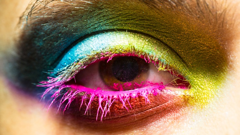 Eye with colorful neon paint fashion makeup. Holi, paint party, colors festival, indian culture inspired. - Image 