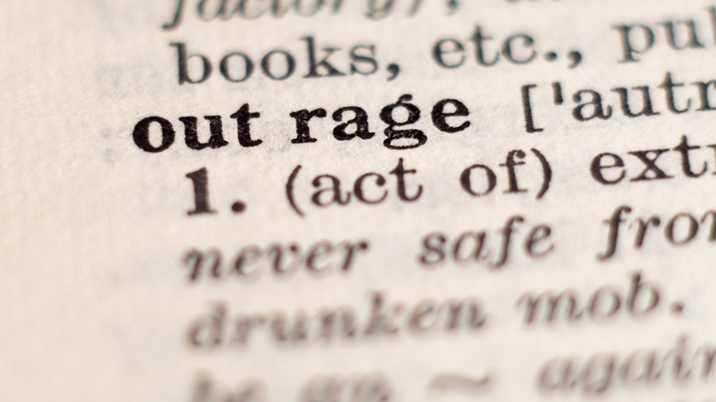 Dictionary definition of word outrage, selective focus. - Image 