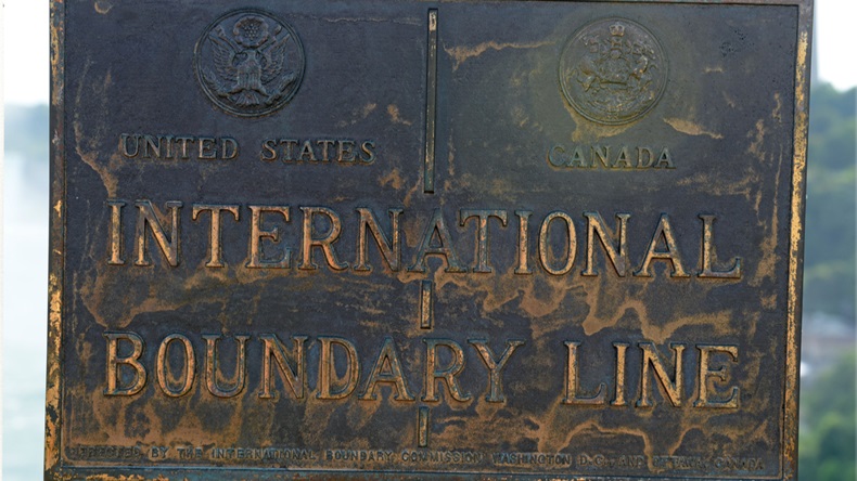 Canadian - United States border sign
