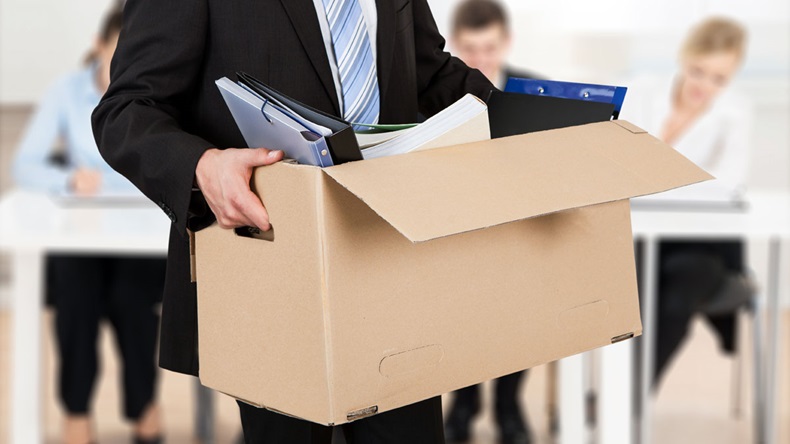 Close-up Of A Businessperson Carrying Cardboard Box During Office Meeting