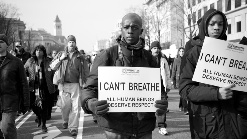 WASHINGTON - DECEMBER 13: Protesters march against police shootings and racism during a rally in Washington, DC on December 13, 2014