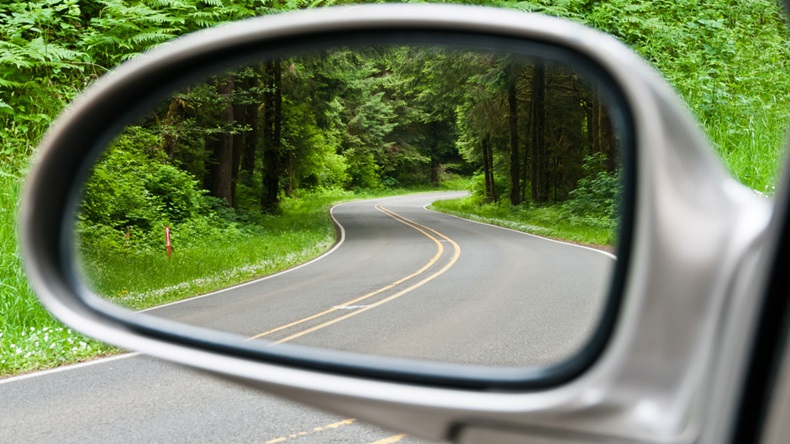 Side-view mirror on car looking back